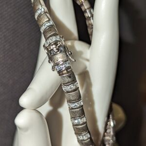 Vintage 925 Sterling Silver and CZ clear stones.